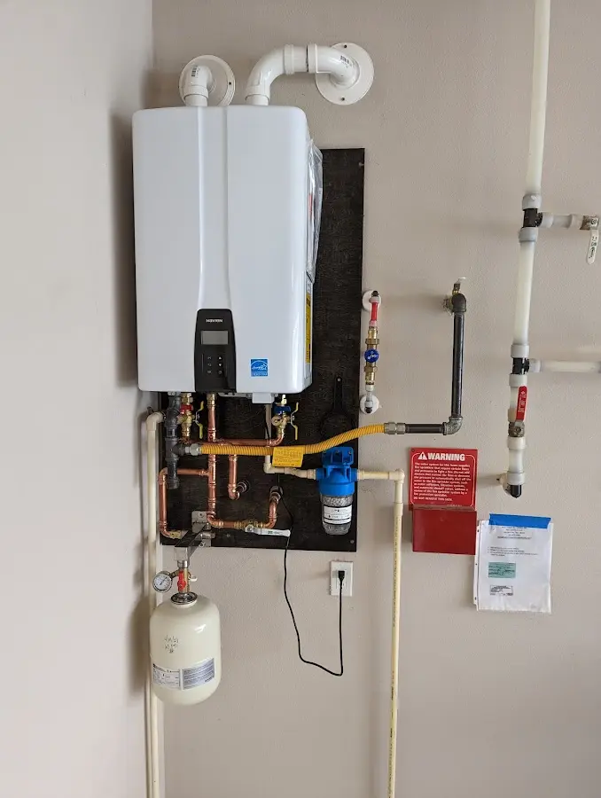 Professional plumber installing copper piping in a Shelbyville home